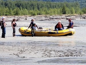 People Stranded with Raft Stuck in Shallow Water