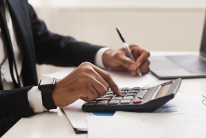 man using calculator